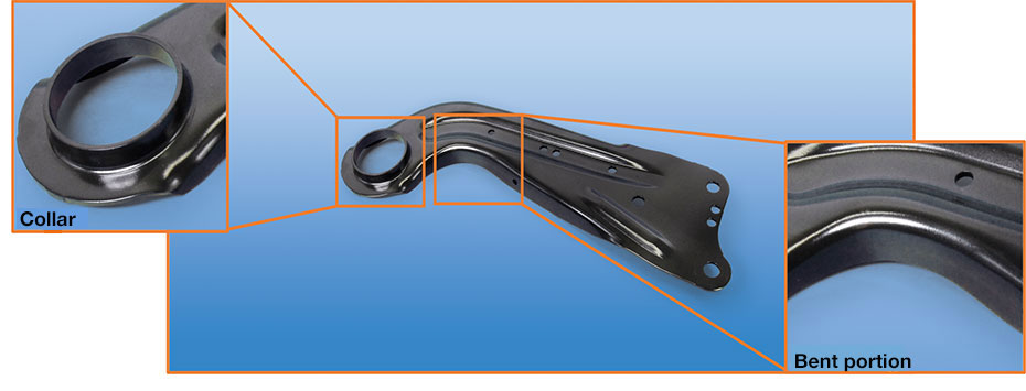 Photo of car trailing arm with collared hole.