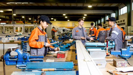 Basic metal training Photo of a trainer with trainees at the basic metal training